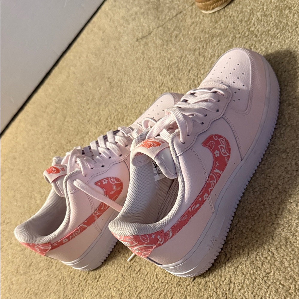 Nike Women's Light Pink Sneakers with Red Accents